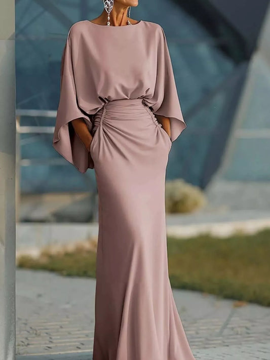 Batwing ruched maxi dress in pink by Pinup Girl Clothing.