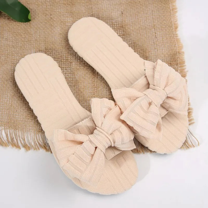 Leyla bow-knot open-toe slide sandals in cream by Pinup Girl Clothing