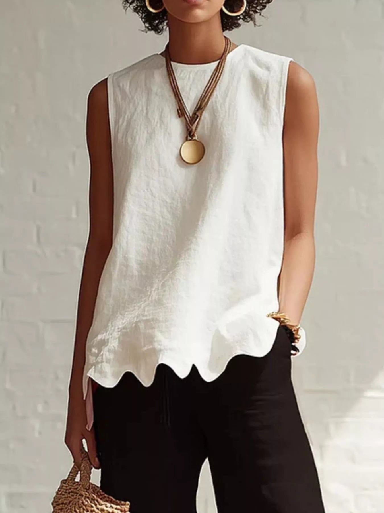 Odile scalloped hem sleeveless blouse in white by Pinup Girl Clothing