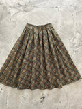 Doris pleated swing skirt in green plaid cotton by Pinup Girl Clothing