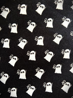 Close up of the white ghost print on the black cotton Mini Ghosts skater skirt