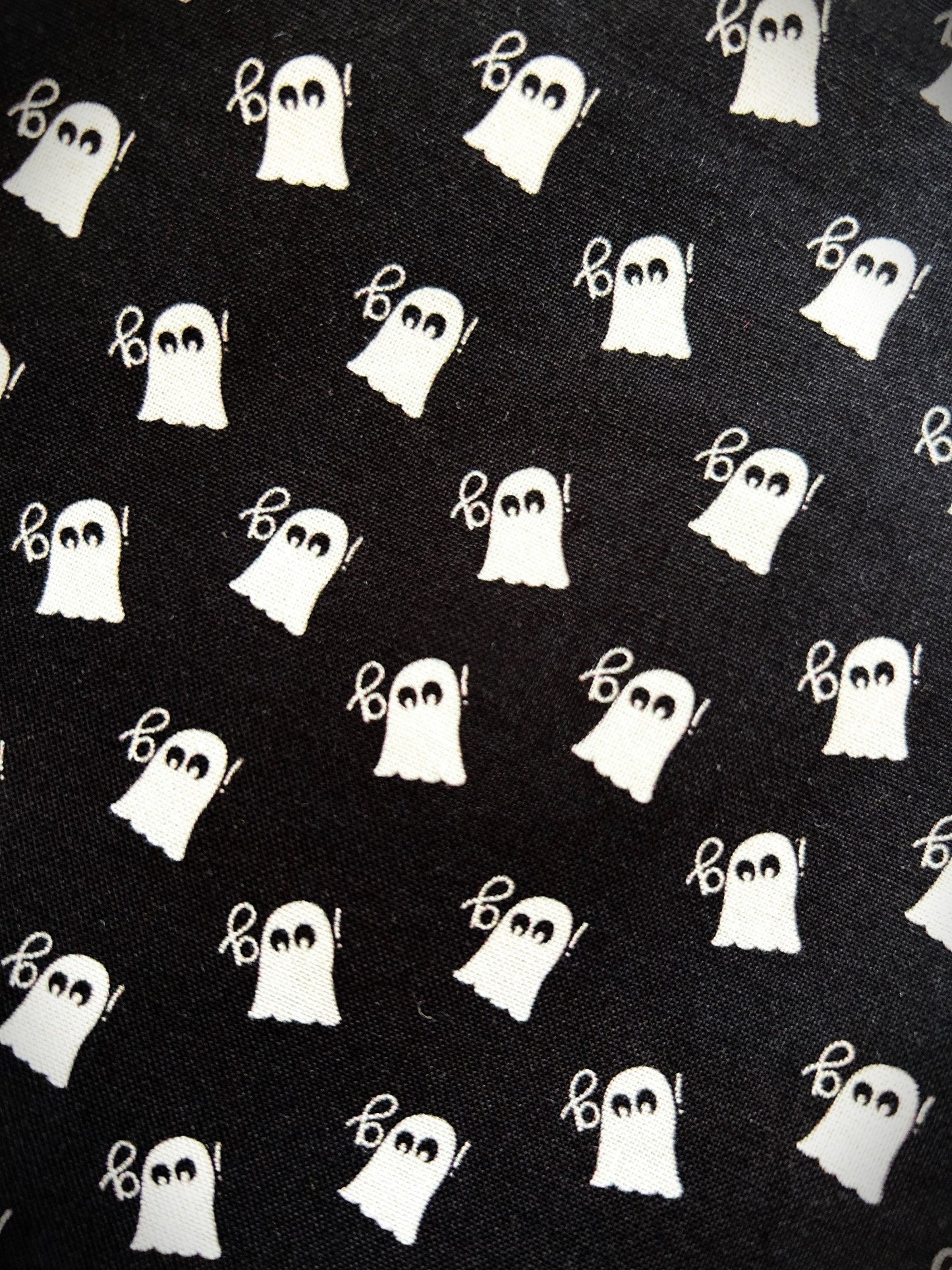 Close up of the white ghost print on the black cotton Mini Ghosts skater skirt