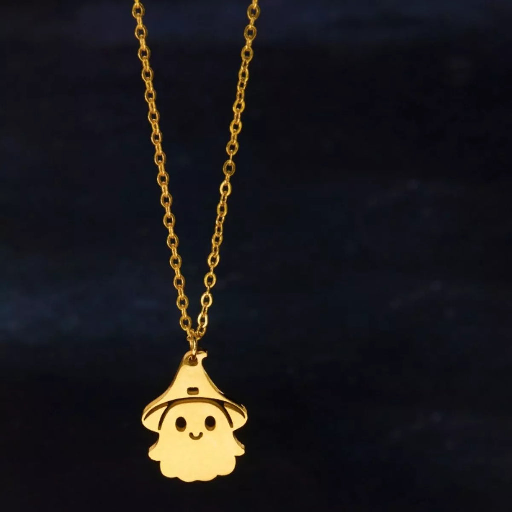 Gold ghost pendant necklace shown on the chain with extender