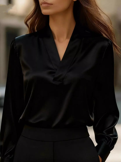 Vintage Noir V-neck satin blouse in black by Pinup Girl Clothing.