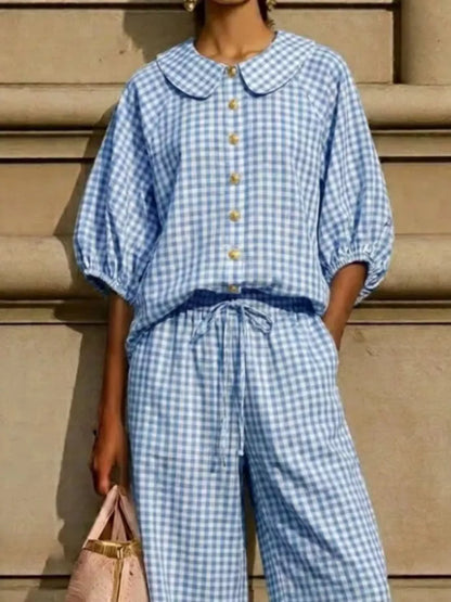 Rounded collar and button front detail on the Bettina gingham blouse, by Pinup Girl Clothing