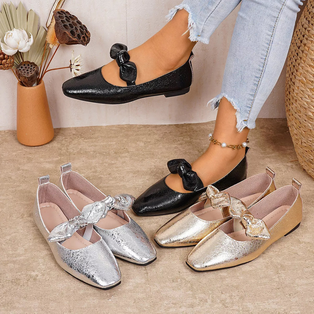 Bow square-toe slip-on flats by Pinup Girl Clothing, in black, gold, or gray, US 4 to 11.