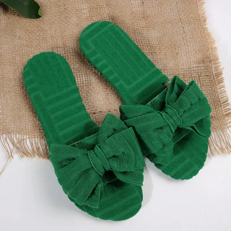 Leyla bow-knot open-toe slide sandals in green by Pinup Girl Clothing