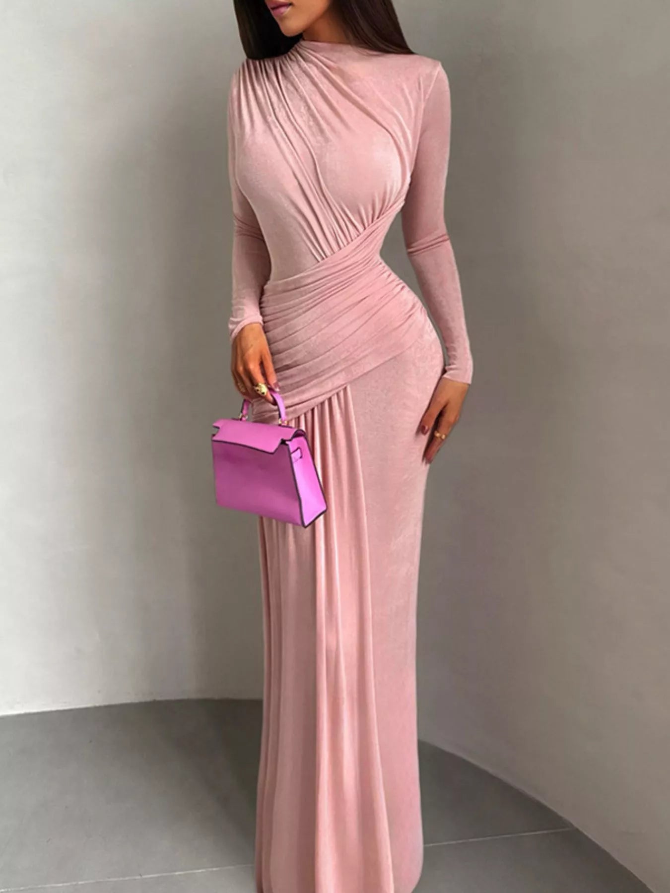 Ruched long-sleeve maxi dress in pink by Pinup Girl Clothing.