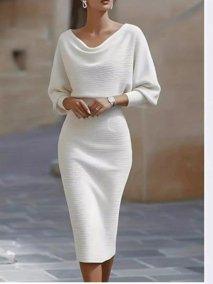 Model in the Silver Screen cowl-neck knit bodycon dress in white, by Pinup Girl Clothing