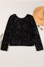 Countdown black sequin long sleeve top styled with leather shorts