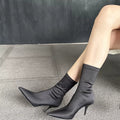 Siren pointed toe stretch sock boots in black, side view