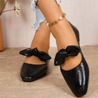 Bow square-toe slip-on flats in black by Pinup Girl Clothing.