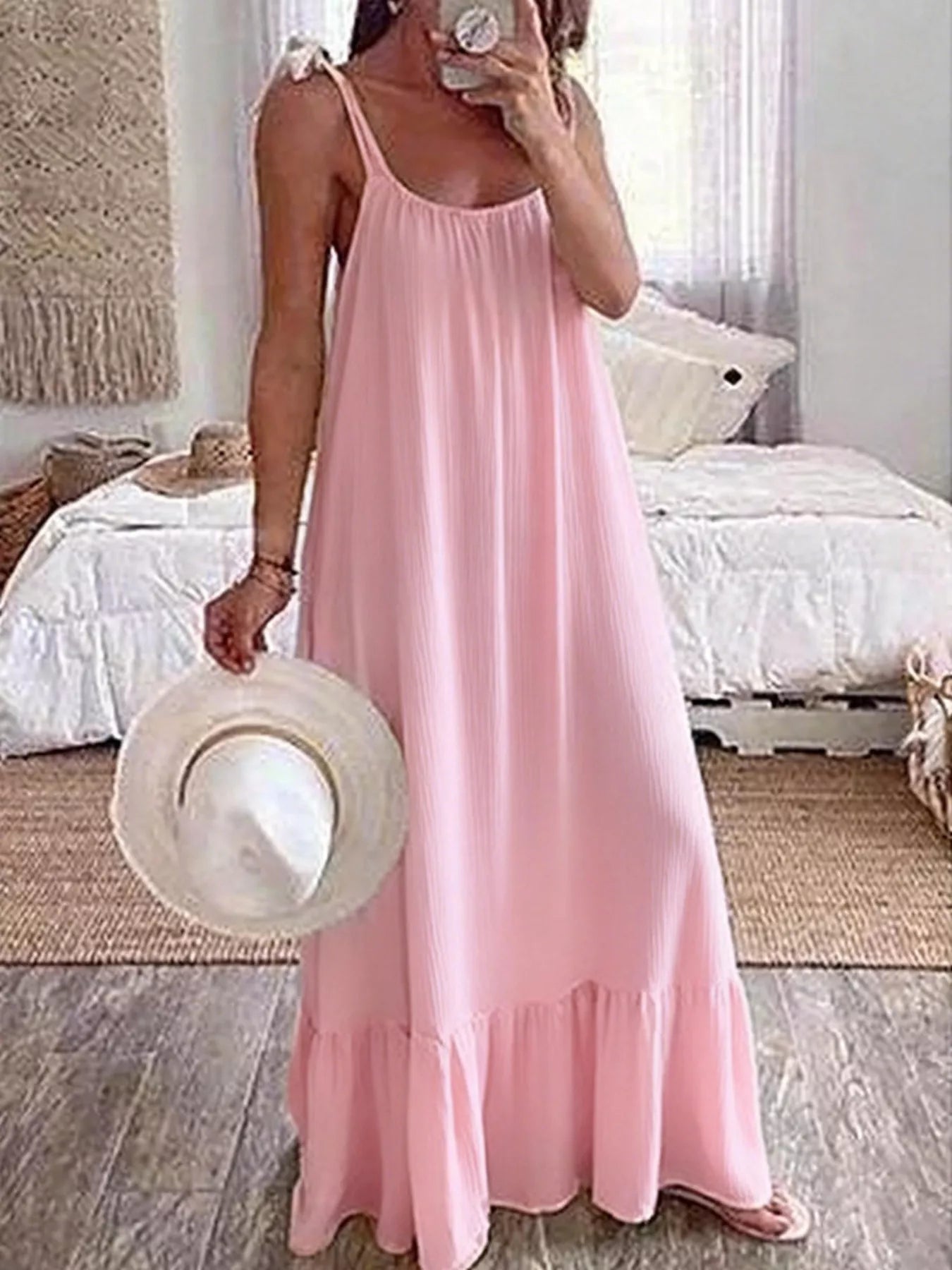 Tie-strap flowy maxi dress in pink by Pinup Girl Clothing.
