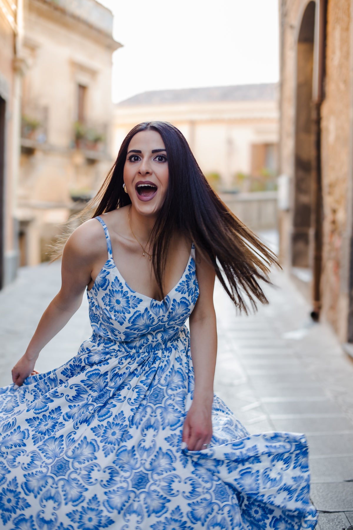 Amalie 70s ballerina swing dress in blue Noto tile print, back view with zip