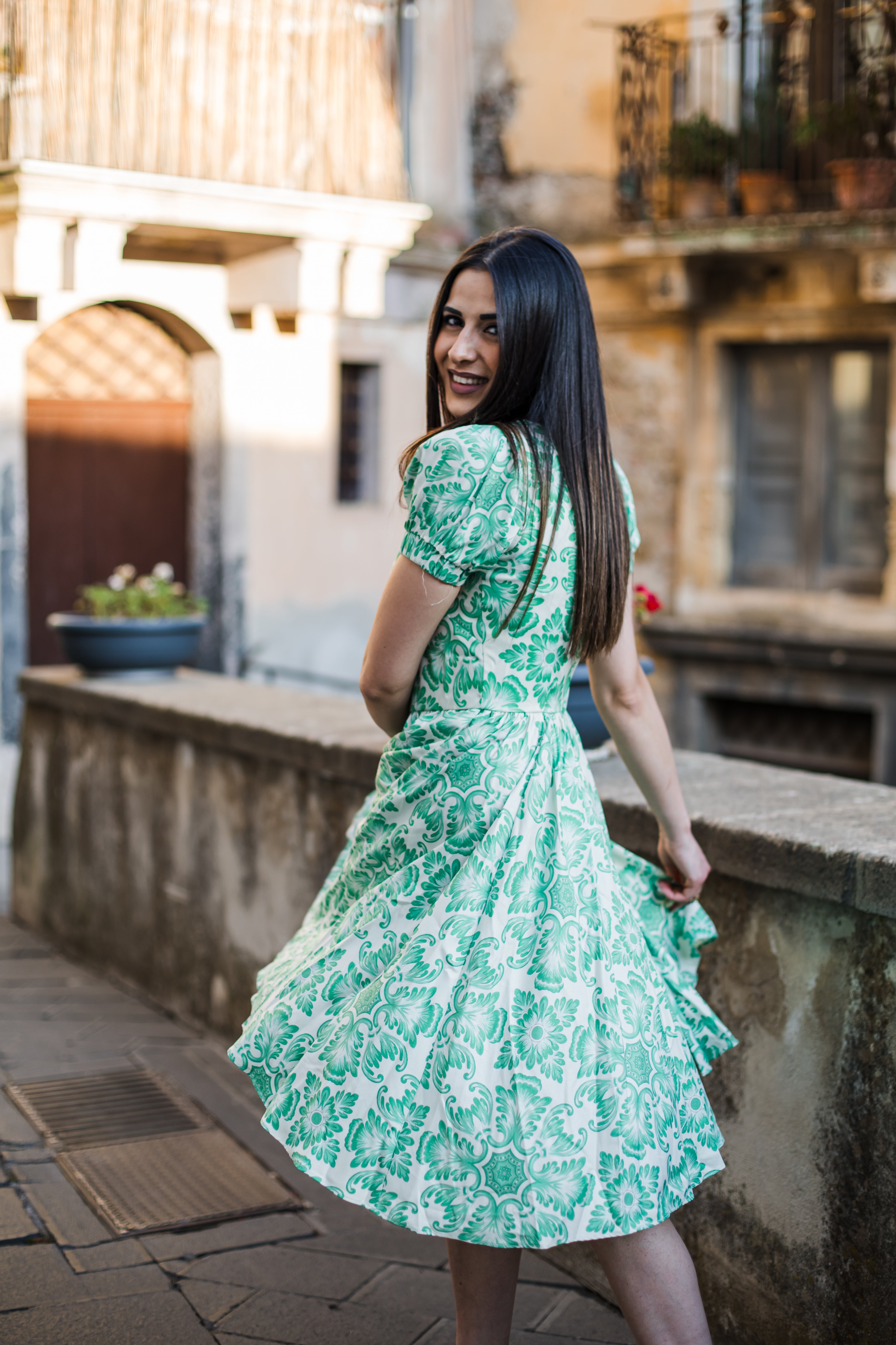 Amara swing dress in green and white Noto Tile print with puff sleeves and a full swing skirt, by Pinup Girl Clothing