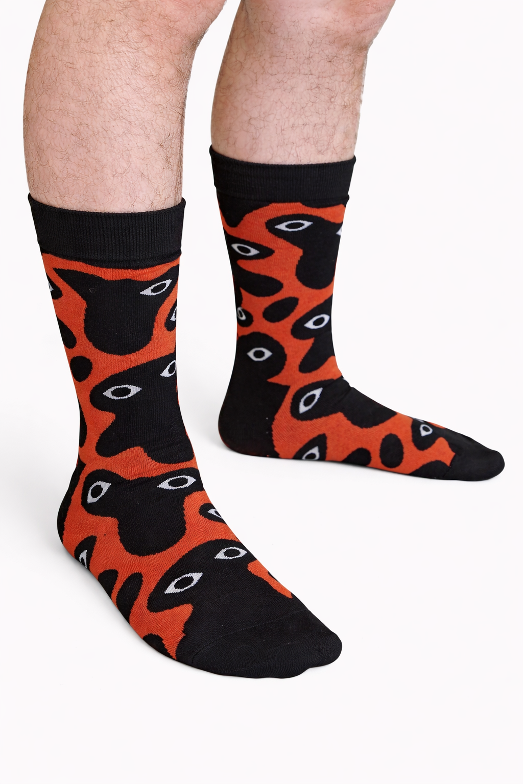 Bauhaus Nightmare Socks, black and orange crew socks with an eyeball blob print (view 2)