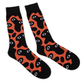 Bauhaus Nightmare Socks, black and orange crew socks with an eyeball blob print