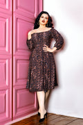 Marie-Therese peasant dress in leopard print crepe, off-shoulder bodice with long sleeves and a full skirt