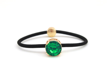 Crown Jewel ponytail hair tie with an emerald green crystal, by Pinup Girl Clothing