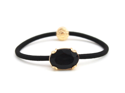 Crown Jewel ponytail hair tie with a jet black crystal, by Pinup Girl Clothing
