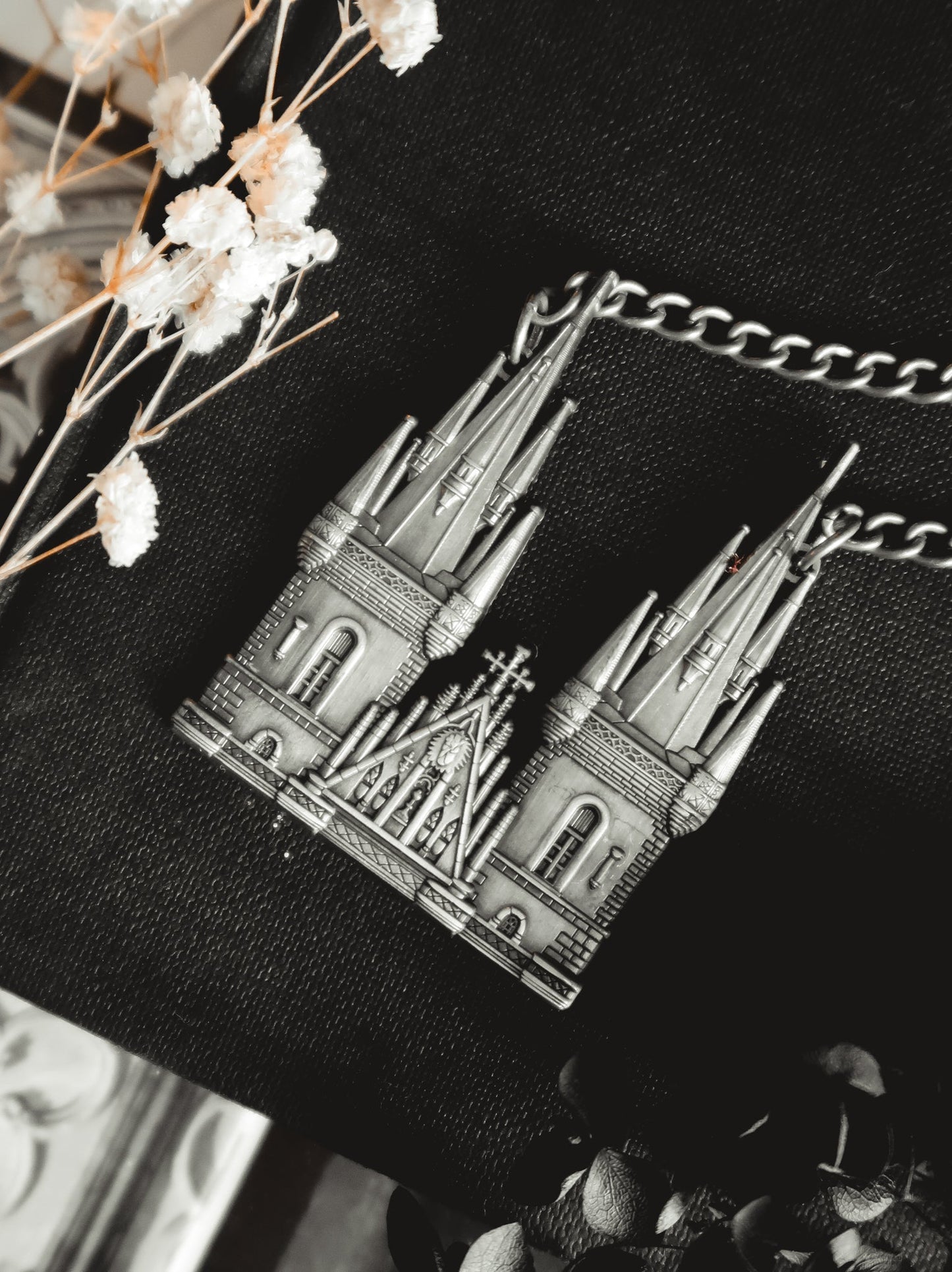 Model wearing the Tyn Cathedral antique silver cathedral pendant