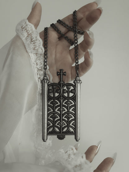 Model wearing the Rotunda Relic antique silver gate pendant