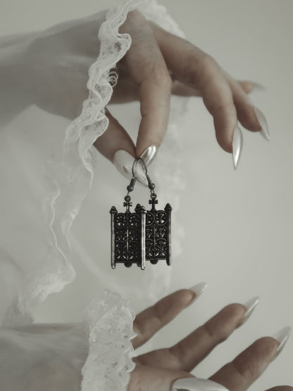 Model wearing the Rotunda Relic silver gothic gate earrings, The Pretty Cult