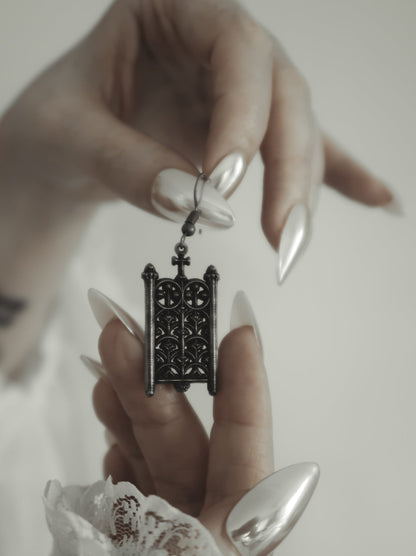 Close-up of the Rotunda Relic silver gate earring worn on the ear, The Pretty Cult