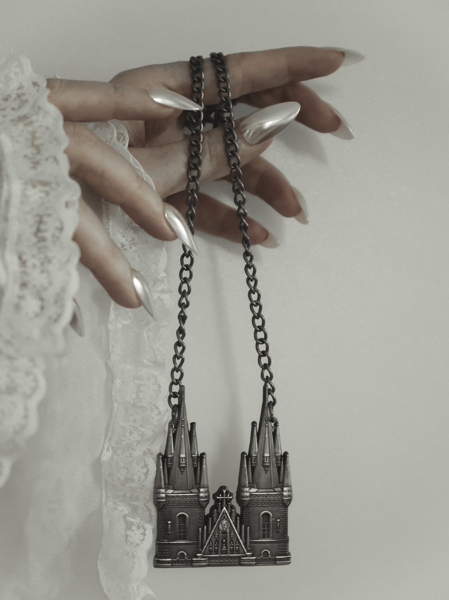 Tyn Cathedral antique silver statement necklace styled on model