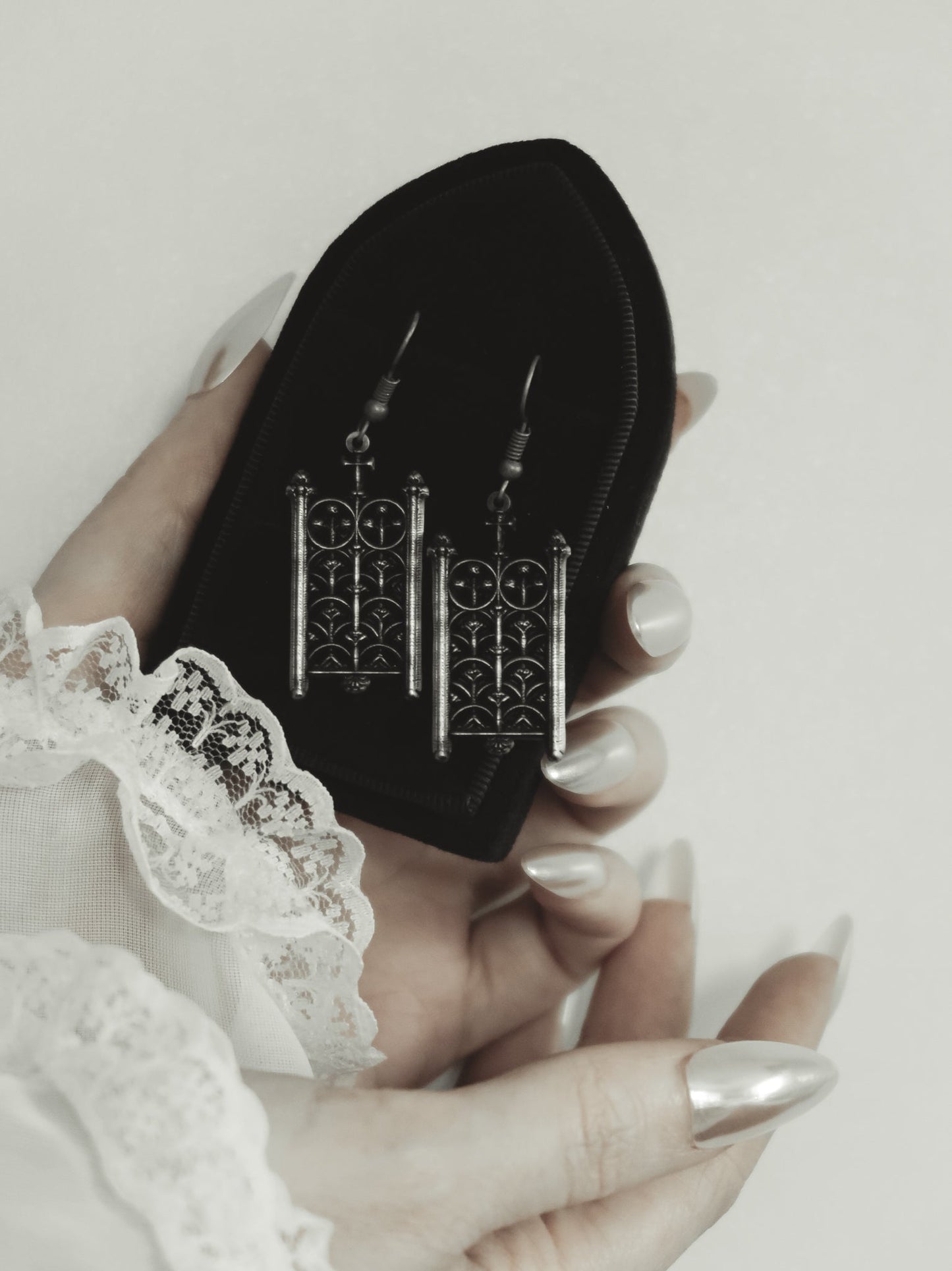 Antiqued silver Rotunda Relic gothic gate earrings held in hand, by The Pretty Cult