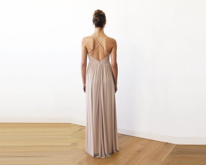 Back view of the Vivienne champagne maxi gown showing the crisscross adjustable straps