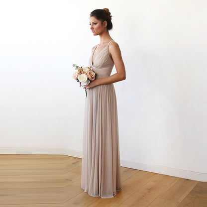 Model in the Vivienne champagne chiffon maxi gown with triangle bodice, V neckline and adjustable crisscross spaghetti straps