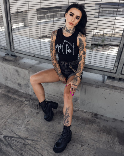 Sleeveless black crop top, side view