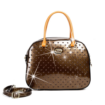 Starz Art retro crystal-studded vegan leather overnight bag with a latch closure and detachable strap, from Pinup Girl Clothing
