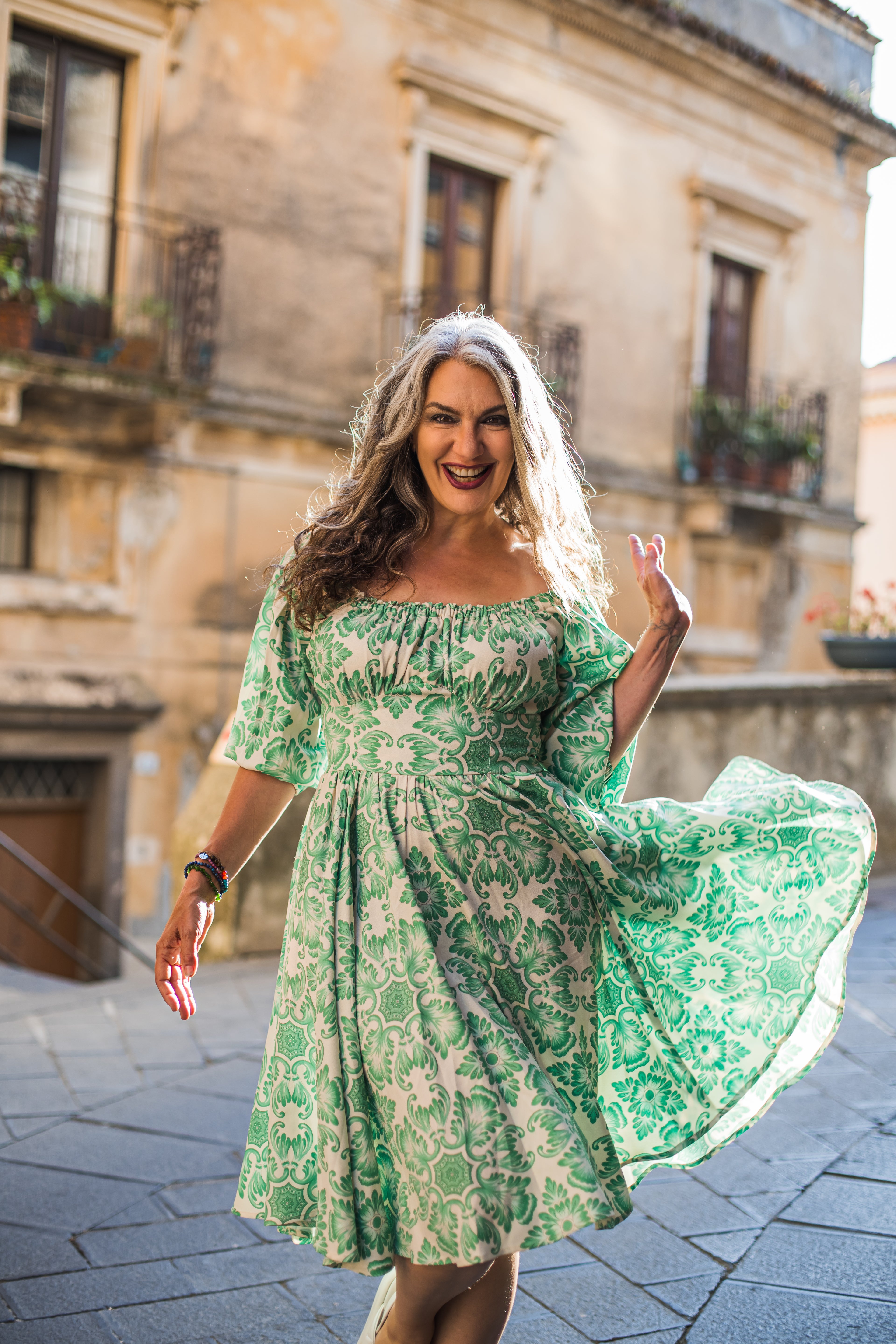 Marie-Therese peasant day dress in green and white Noto Tile print with a full skirt and deep pockets, by Pinup Girl Clothing