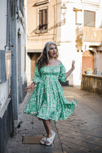 Marie-Therese peasant day dress in green and white Noto Tile print with a full skirt and deep pockets, by Pinup Girl Clothing