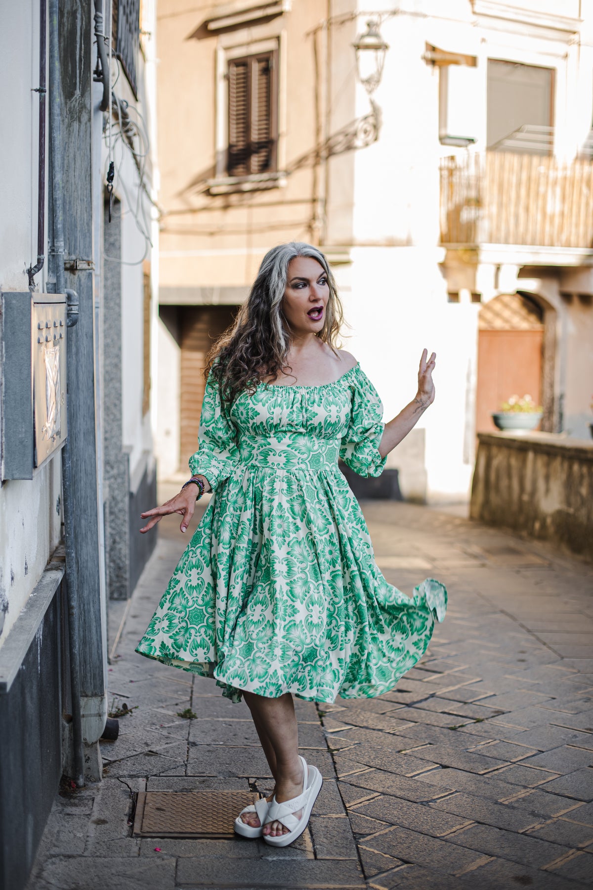 Marie-Therese peasant day dress in green and white Noto Tile print with a full skirt and deep pockets, by Pinup Girl Clothing