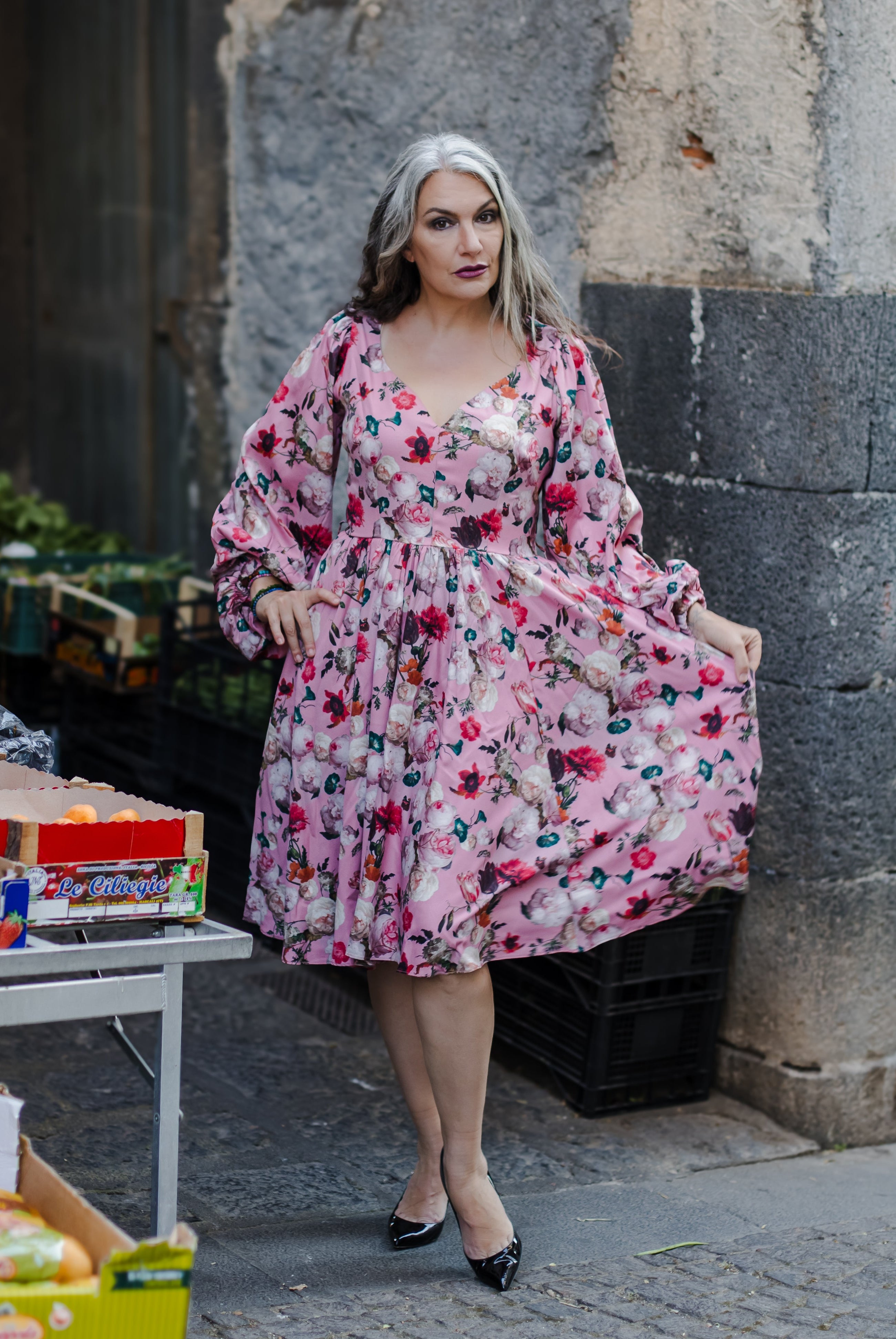 Kara swing dress in mauve Ambrosia Floral with a plunging V neckline and bell sleeves, by Pinup Girl Clothing