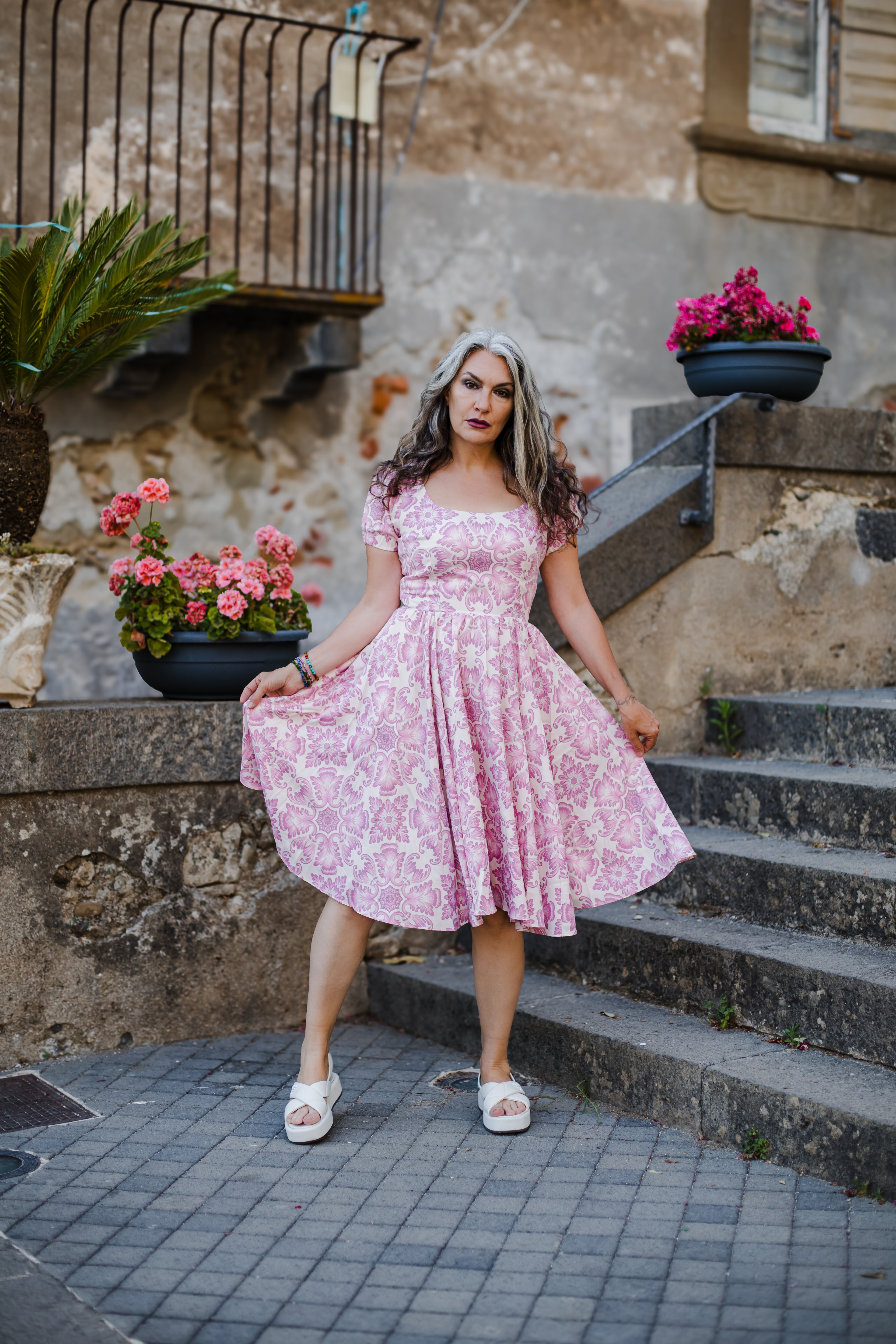 Amara swing dress in pink and white Noto Tile print with puff sleeves and a full swing skirt, by Pinup Girl Clothing