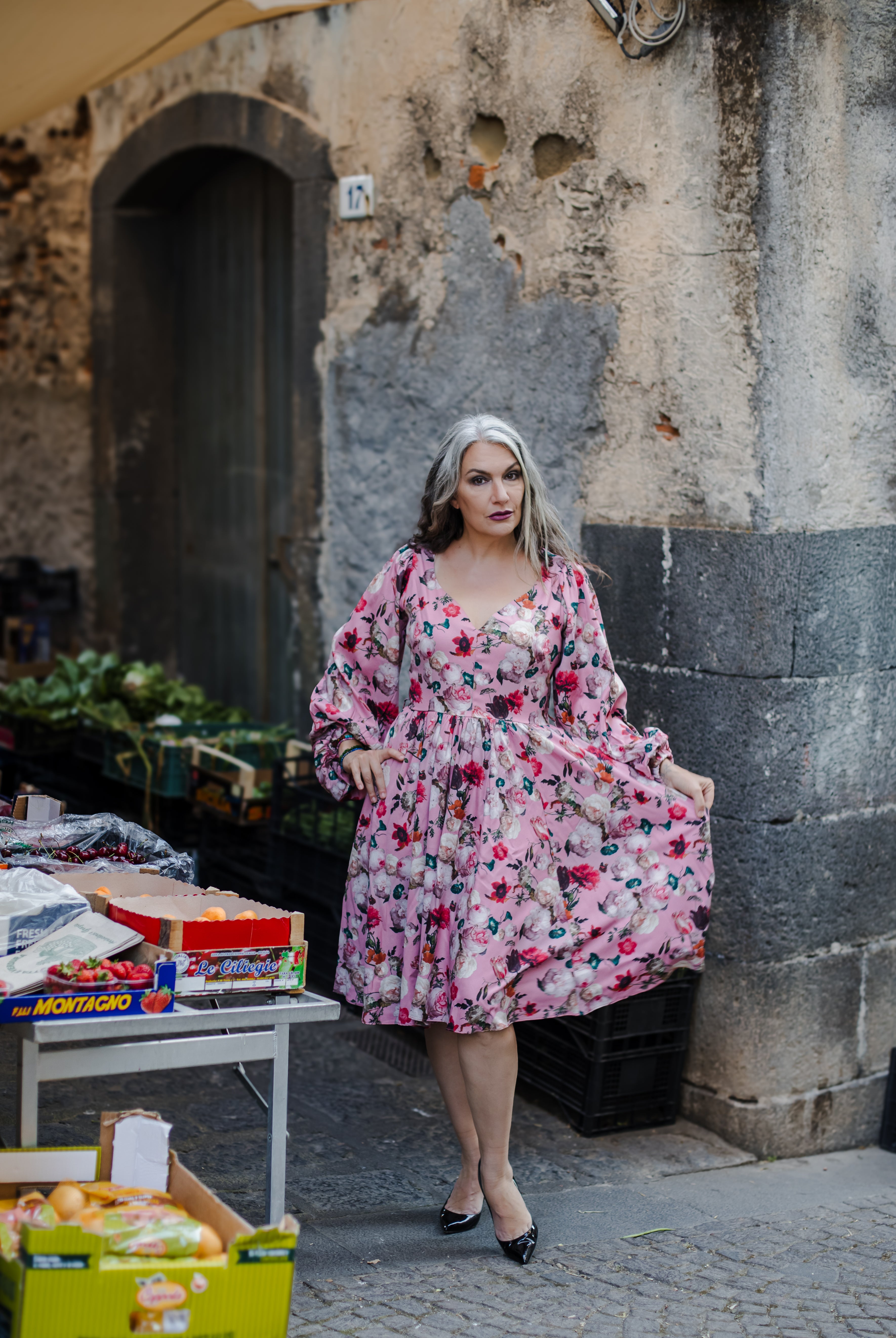 Kara swing dress in mauve Ambrosia Floral with a plunging V neckline and bell sleeves, by Pinup Girl Clothing