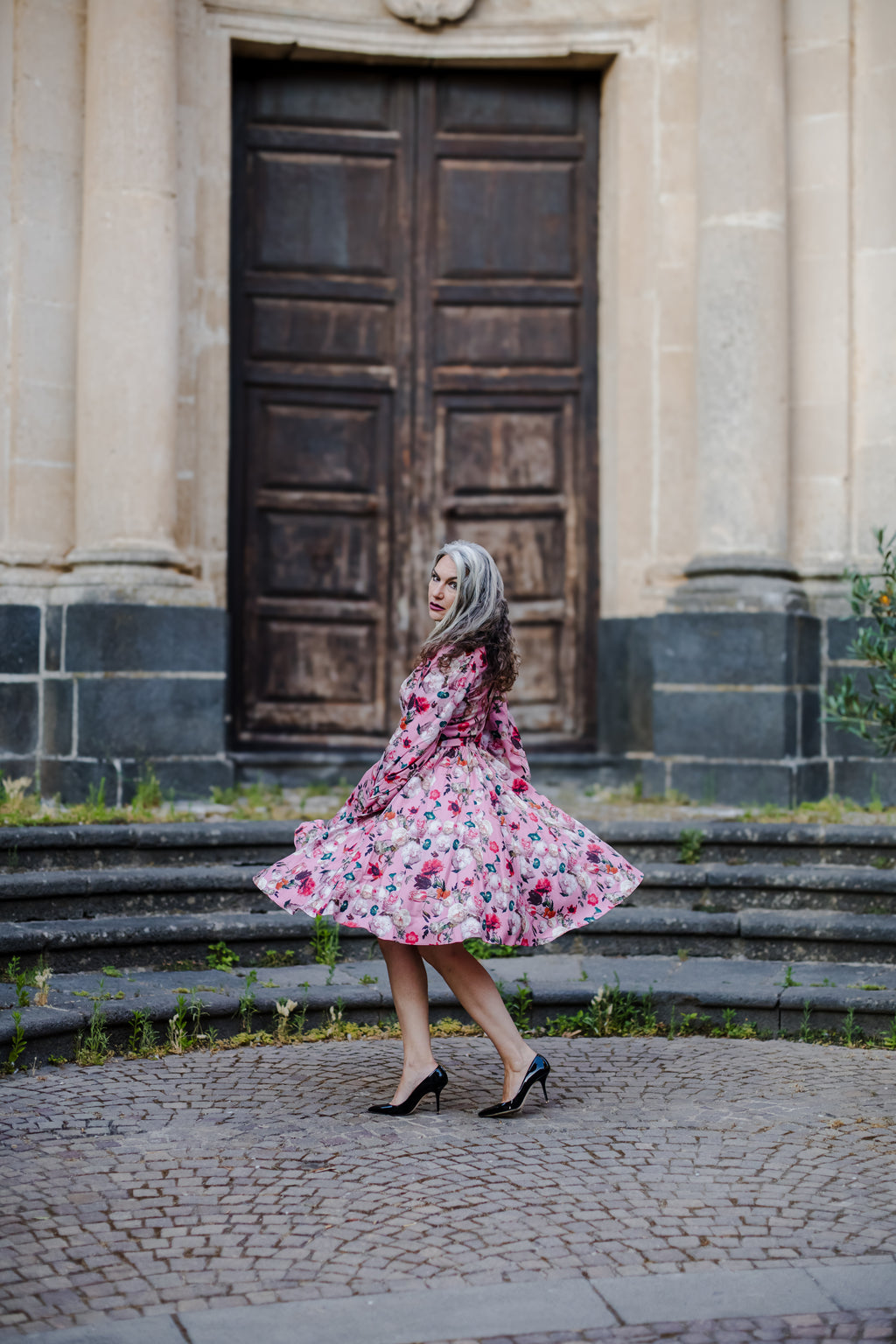 Kara swing dress in mauve Ambrosia Floral with a plunging V neckline and bell sleeves, by Pinup Girl Clothing