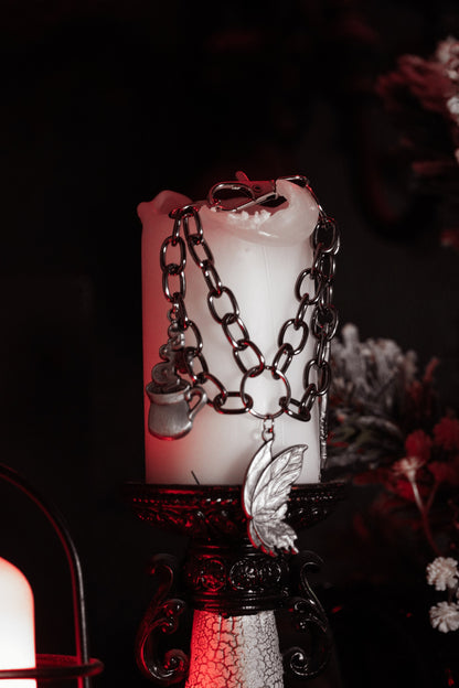 Close up of The Afternoon Tea silver charms on the wrist