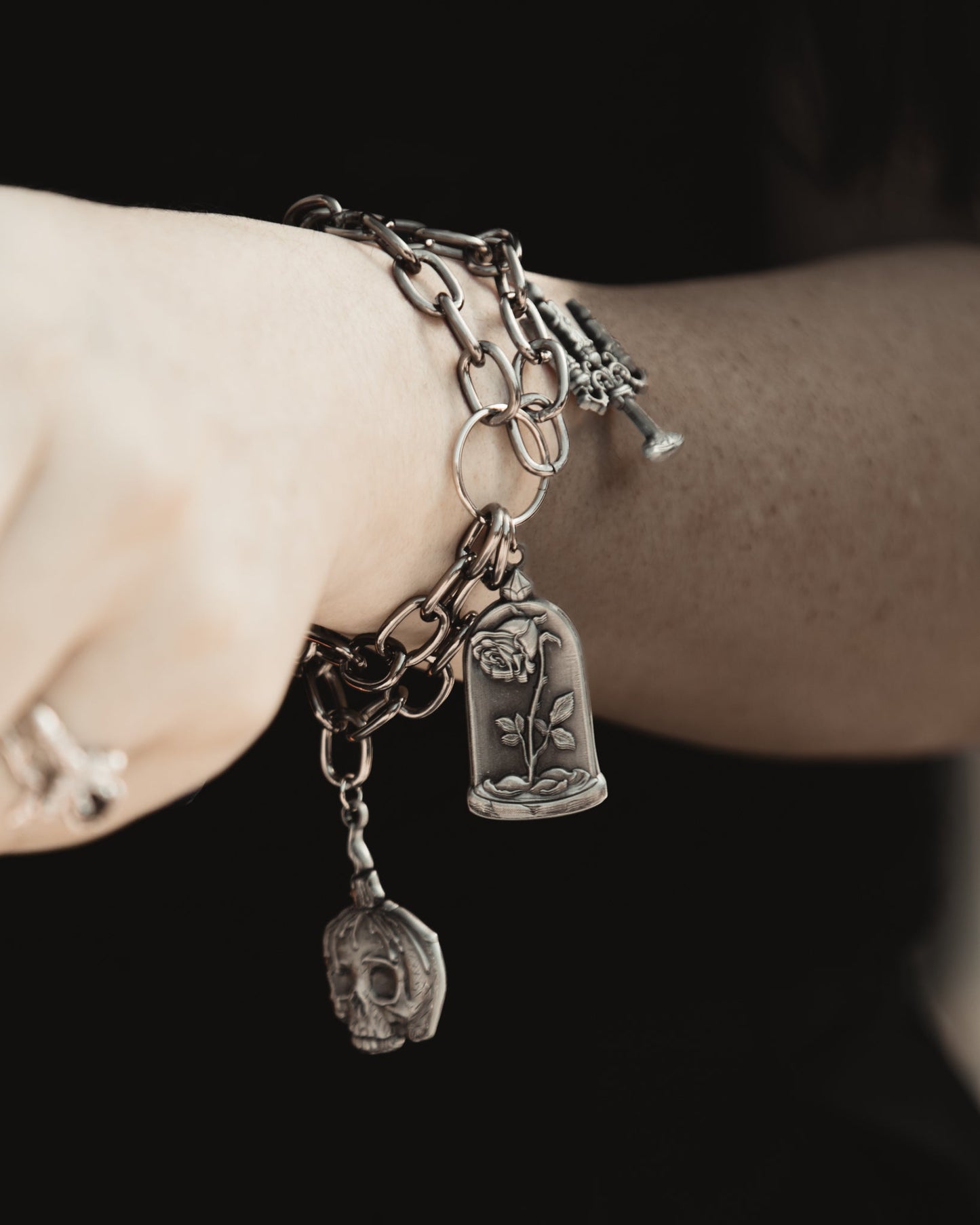 The Saint's Shadow silver adjustable charm bracelet detail