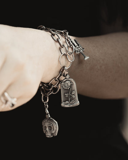 The Saint's Shadow silver adjustable charm bracelet detail