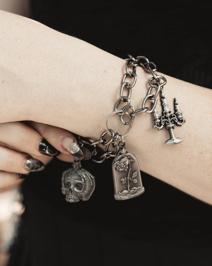 Model wearing The Saint's Shadow silver charm bracelet