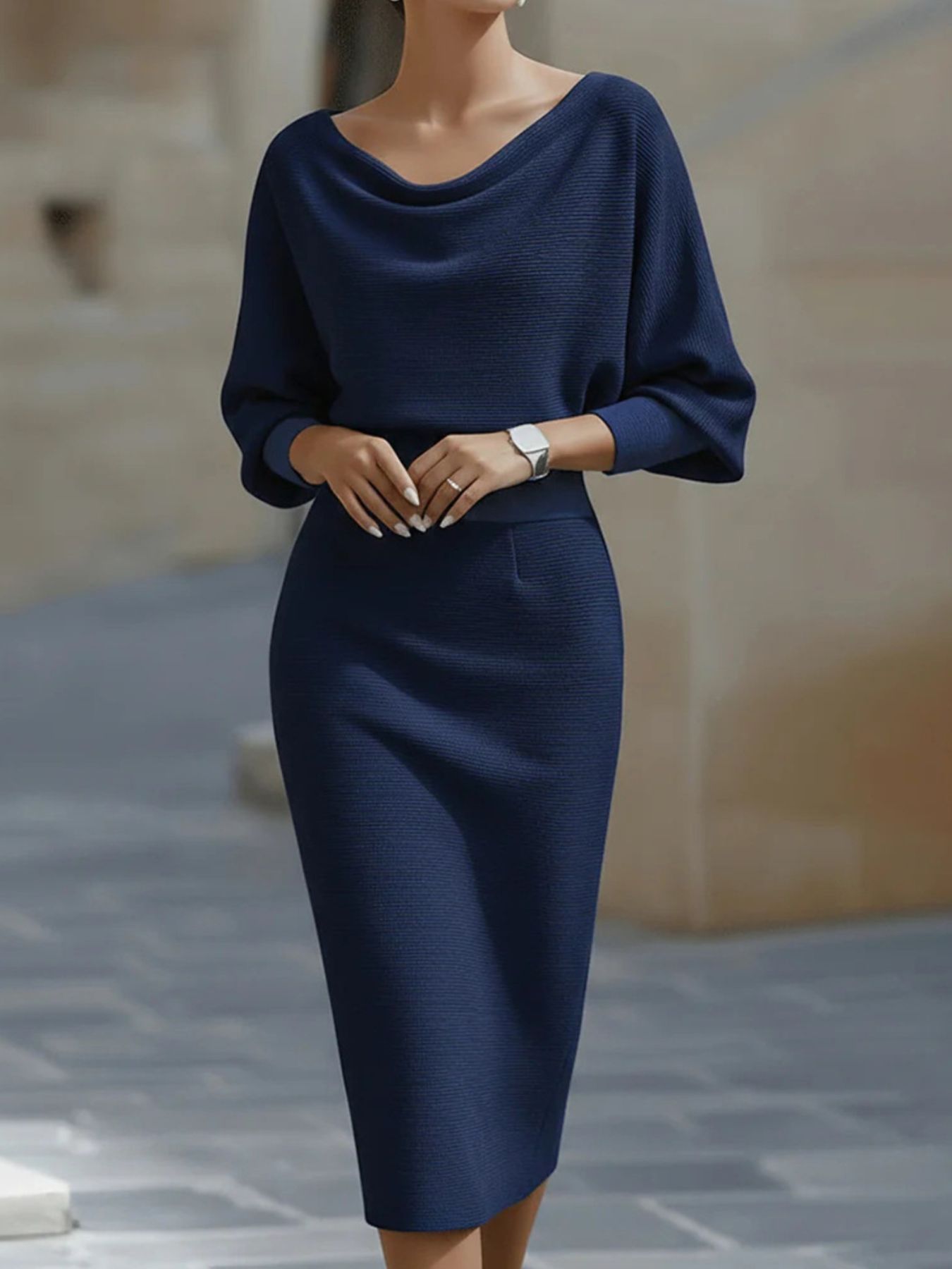 Model in the Silver Screen cowl-neck knit bodycon dress in navy blue, by Pinup Girl Clothing