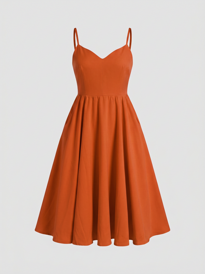 Amalie Ballerina 70s swing dress in Amber Harvest on an invisible mannequin, showing the sweetheart neckline, fitted bodice and gathered mid-calf skirt