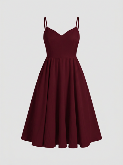 Amalie Ballerina 70s swing dress in burgundy on an invisible mannequin, showing the sweetheart neckline, fitted bodice and gathered mid-calf skirt