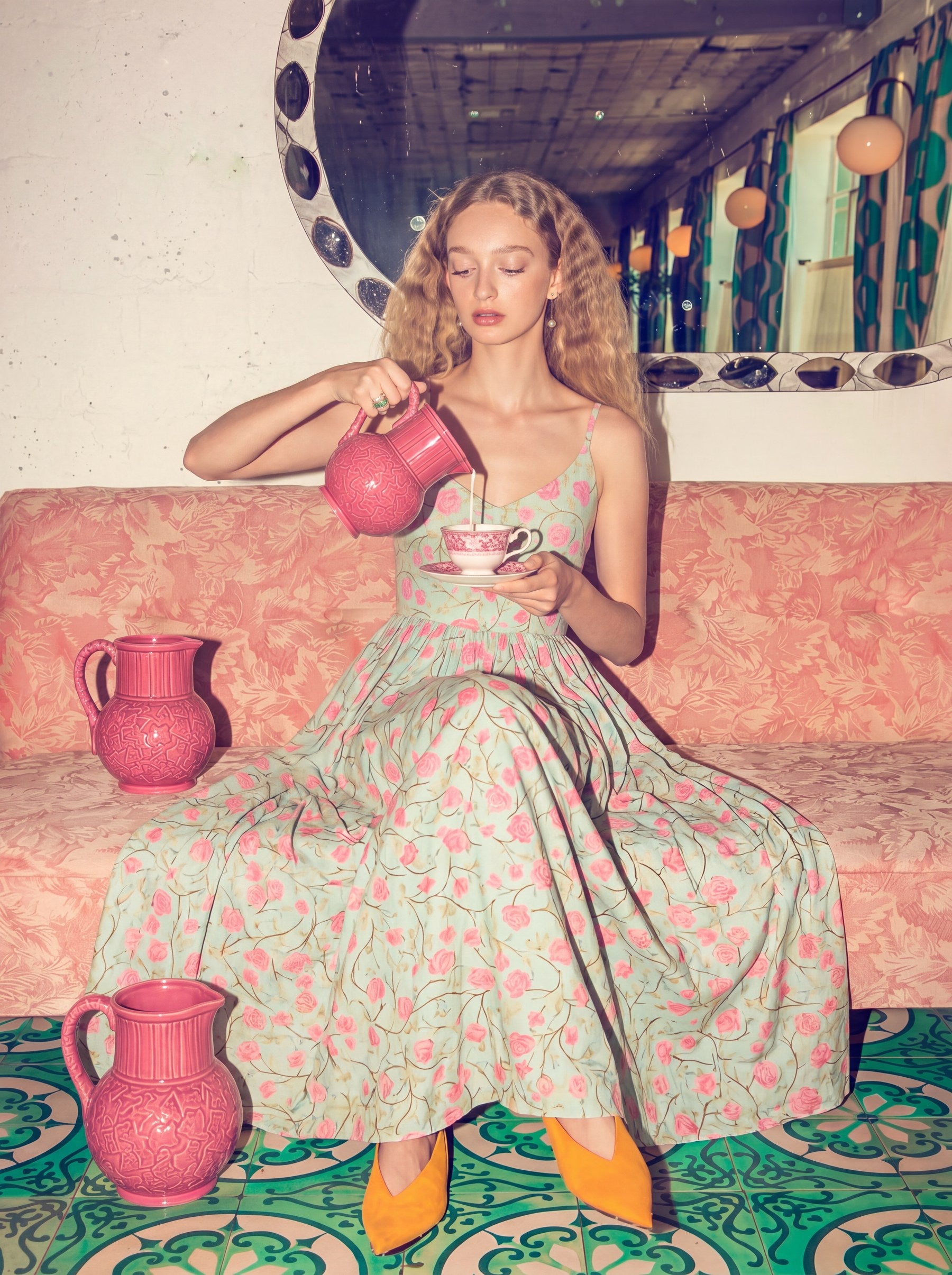 Model in the Amalie Maxi Dress in Rose Silhouette Mint, a 70s-inspired mint maxi with a pink rose print, spaghetti straps and a full gathered skirt