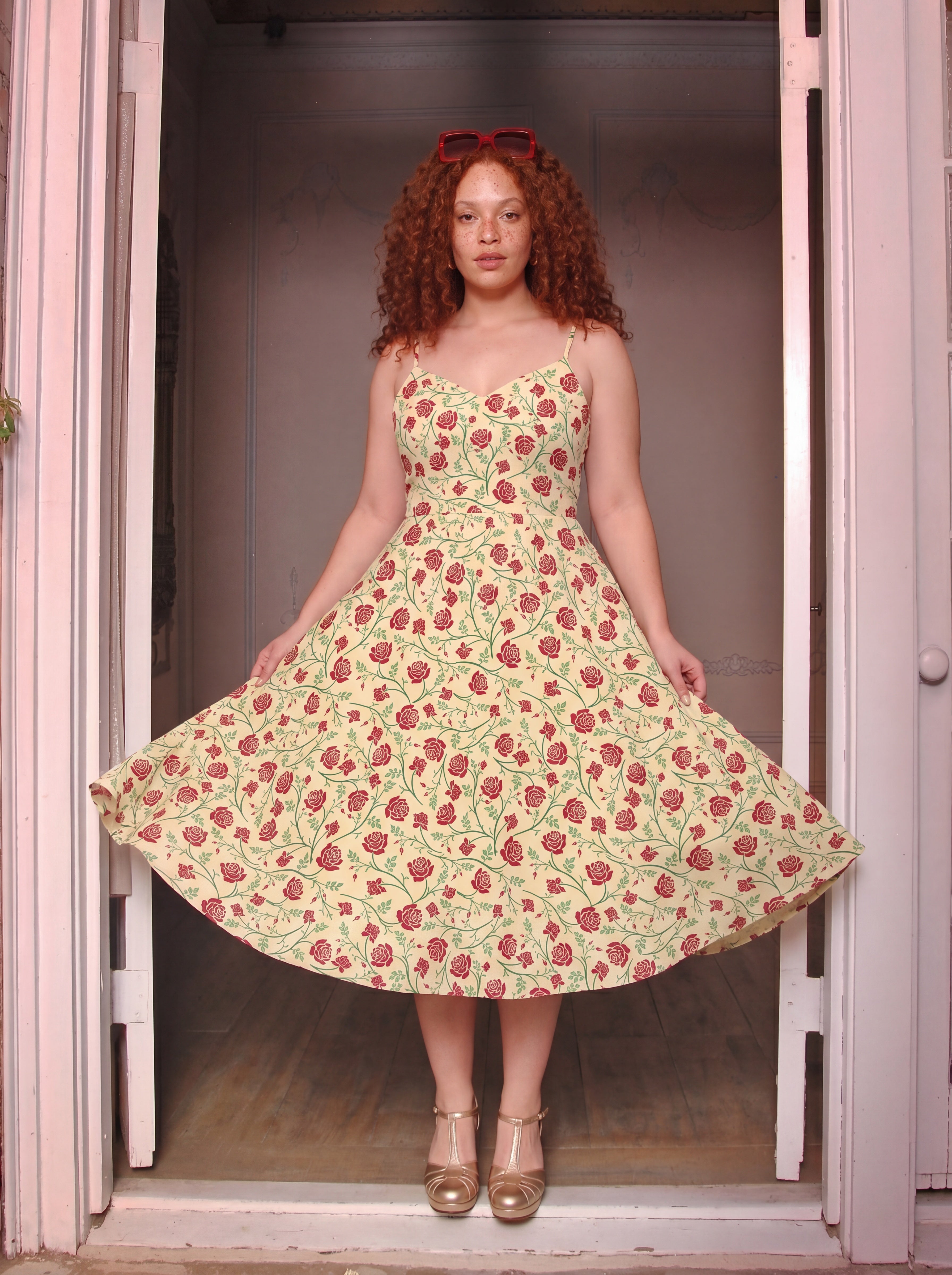 Amalie buttercream rose swing dress with a full twirl skirt and deep pockets, made to order by Pinup Girl Clothing.